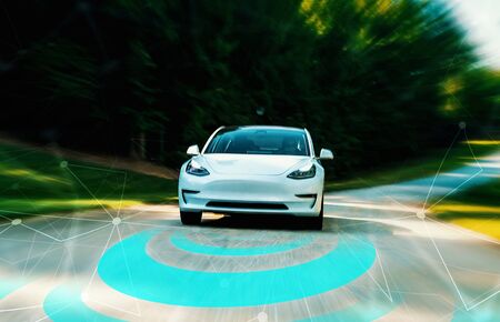 Autonomous self driving car technology concept on a rural roadの写真素材