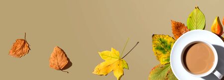 Autumn theme with a cup of coffee - overhead view flat layの写真素材