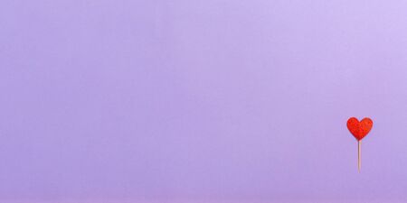 Valentines day heart ornaments on a purple background