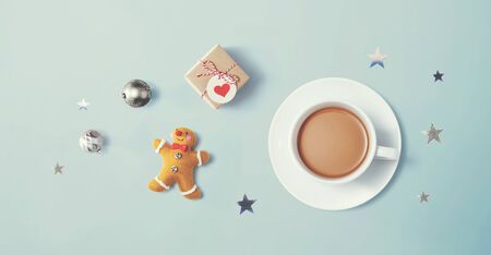 Christmas ornaments with a cup of coffee - flat lay