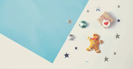Christmas gingerbread with ornaments - overhead view flat lay