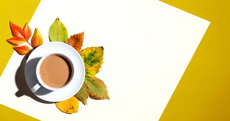 Autumn theme with a cup of coffee - overhead view flat lay