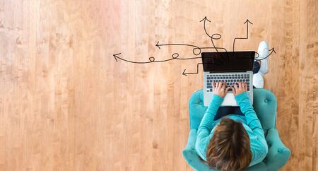 Idea arrows with woman using her laptop computer