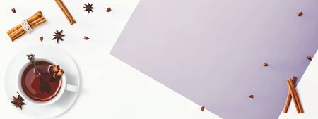 Black tea with cinnamon sticks and star anise - overhead view