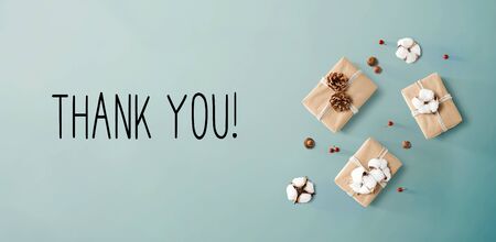 Thank you message with gift boxes with cottons and pine conesの写真素材