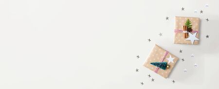 Handmade Christmas gift boxes with ornaments - flat layの写真素材