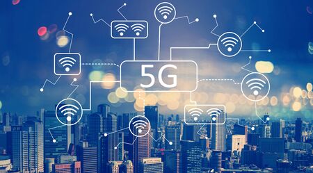 5G network with aerial view of city skylines at nightの写真素材
