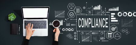 Compliance concept with person using a laptop computerの写真素材