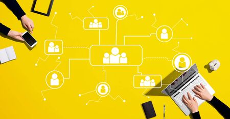 Social connections theme with people working together with laptop and phone