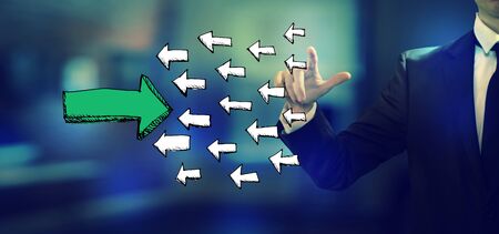 Arrow going in the opposite direction with a businessman in an office