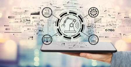 Smart industry concept with man holding a tablet computerの写真素材