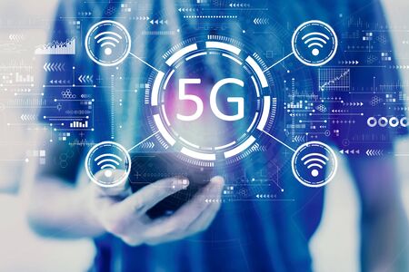 5G network with young man using a smartphoneの写真素材