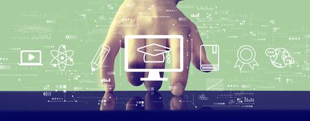 E-learning concept with hand pressing a screen of a tablet computerの写真素材