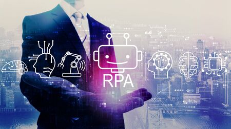 Robotic process automation concept with businessman on a city backgroundの写真素材