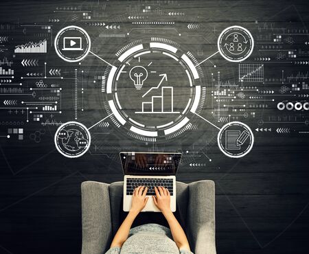 Content marketing concept with person using a laptop in a chairの写真素材