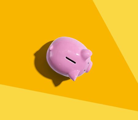 Pink piggy bank overhead view - flat layの写真素材
