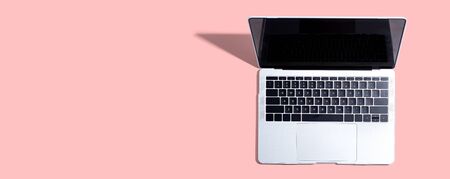 Laptop computer with drop shadow from aboveの写真素材