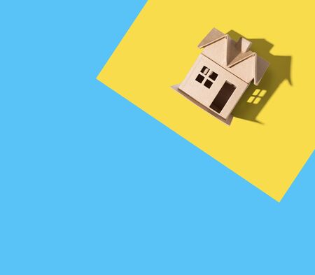 Cardboard house with drop shadow overhead viewの写真素材