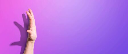 Raised hand protecting stopping or supporting somethingの写真素材