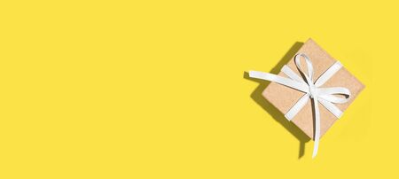 Gift box with ribbon overhead view - flat layの写真素材