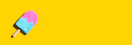 Pink and blue popsicle with shadow - overhead viewの写真素材