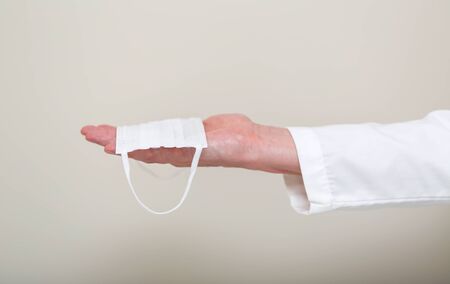 Medical doctor holding a virus in his hand