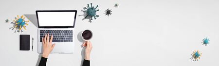 Laptop computer with epidemic influenza concept - overhead viewの写真素材