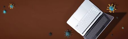 Laptop computer with epidemic influenza concept - overhead viewの写真素材
