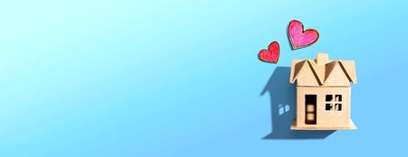 Cardboard house with heart crayon drawings - flatlayの写真素材