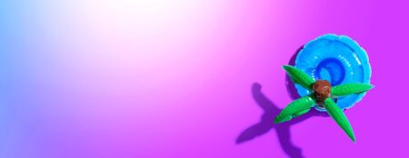 Summer concept with a palm tree float overhead view - flat layの写真素材