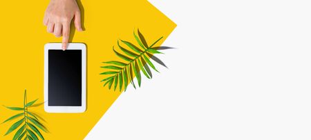 Person using a tablet computer from aboveの写真素材