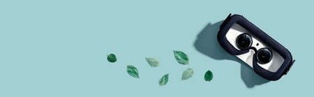 Virtual reality headset with green leaves - flat layの写真素材