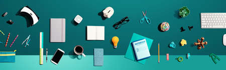 Collection of electronic gadgets and office supplies - flat lay