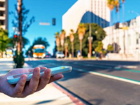 Woman using her smart phone in Downtown Los Angeles, CA