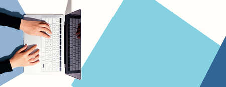 Person using a laptop computer from above