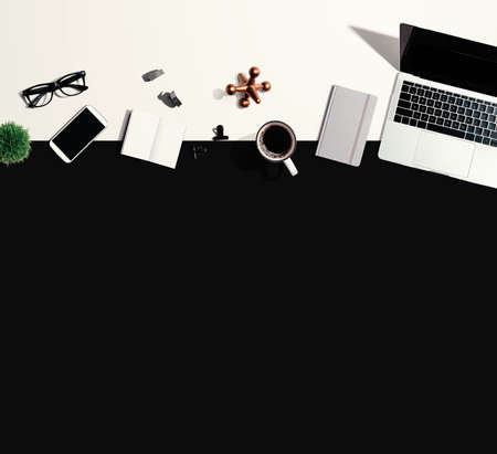 Laptop computer with office supplies - flat lay