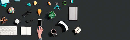 Collection of electronic gadgets and office supplies - flat layの写真素材