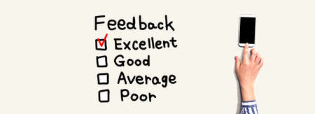 Feedback with person using a smartphone from aboveの写真素材