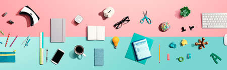 Collection of electronic gadgets and office supplies - flat layの写真素材