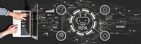 Robotic Process Automation RPA theme with person using a laptop computerの写真素材