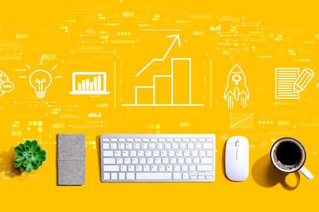 Business growth analysis with a computer keyboard and a mouseの写真素材