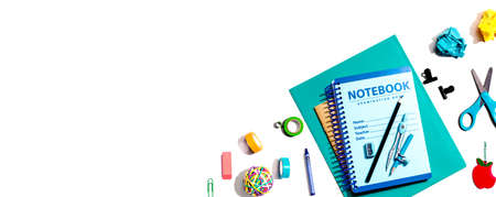 Notebooks with school supplies overhead view - flat layの写真素材