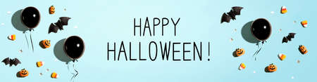 Happy Halloween message with black balloons and Halloween decorationsの写真素材