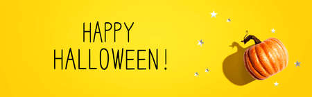Happy Halloween message with a pumpkin and small stars - flat layの写真素材