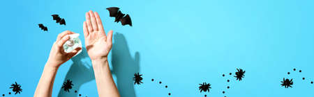 Applying sanitizer gel with Halloween theme - healthcare and hygiene conceptの写真素材