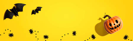 Halloween pumpkin ghost with bats and spiders - flat layの写真素材