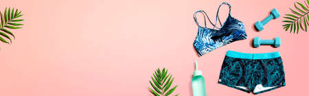 Fitness theme with equipments and sportswear - flat layの写真素材