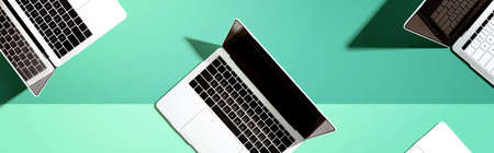 Many Laptop computers with shadow from aboveの写真素材