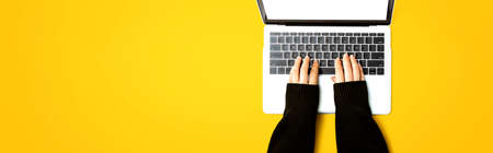 Person using a laptop computer from above