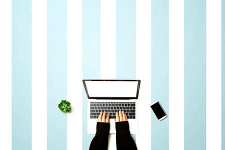 Person using a laptop computer from above